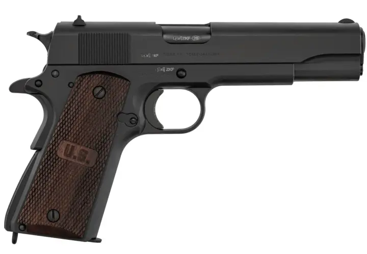 Pistolet noir avec poignées en bois gravées "U.S.". Le numéro de série 11 43 est visible sur la culasse.