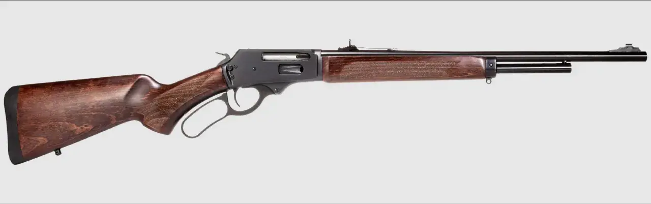Carabine courte pour traqueur, avec crosse et garde-main en bois sombre, mécanisme à levier sous garde. Idéale pour la chasse discrète.